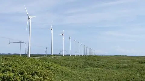 The line of wind turbines at the Otonrui wind farm along the coast road